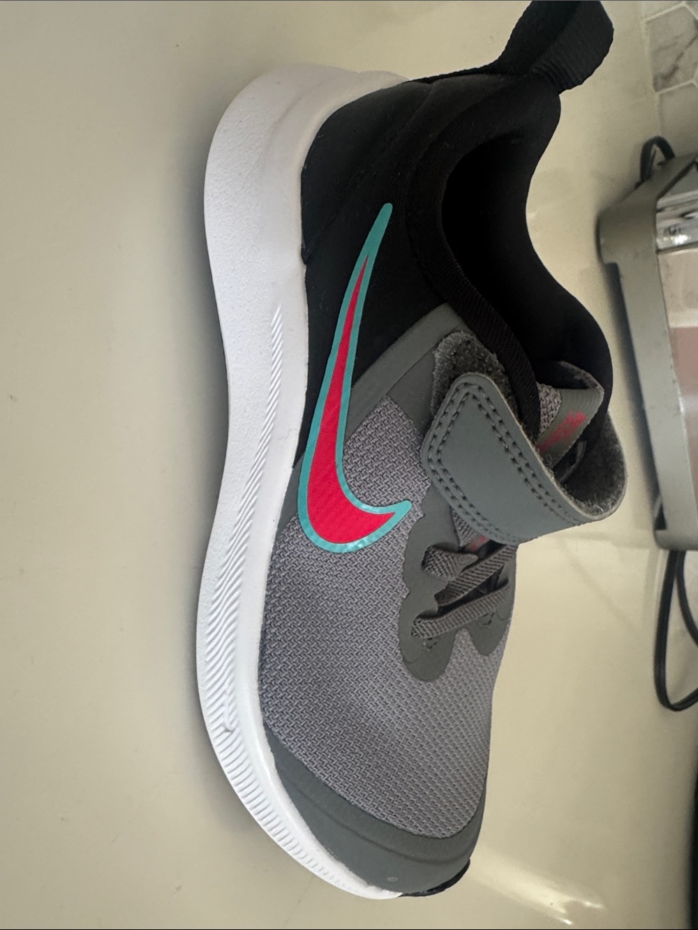 Nike Grey Trainer with Red & Teal Swoosh
